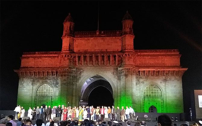 Dignitaries gather on stage to sing the National Anthem at the Indian Express concert that honoured victims of the Mumbai 26/11 attacks ten years later. Photograph: Vaihayasi Pande Daniel/Rediff.com.