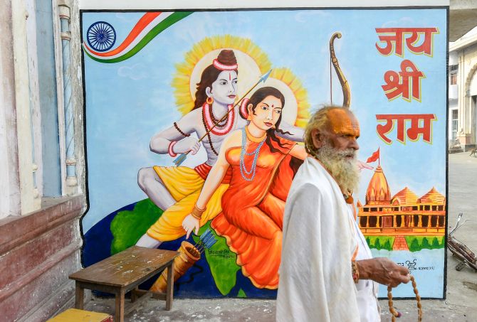 IMAGE: A sadhu counts beads near a temple in Ayodhya. 