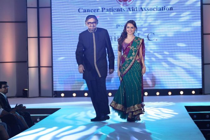 Alyque Padamsee walks the ramp with his youngest child Shazahn Padamsee at a cancer fundraiser in Mumbai