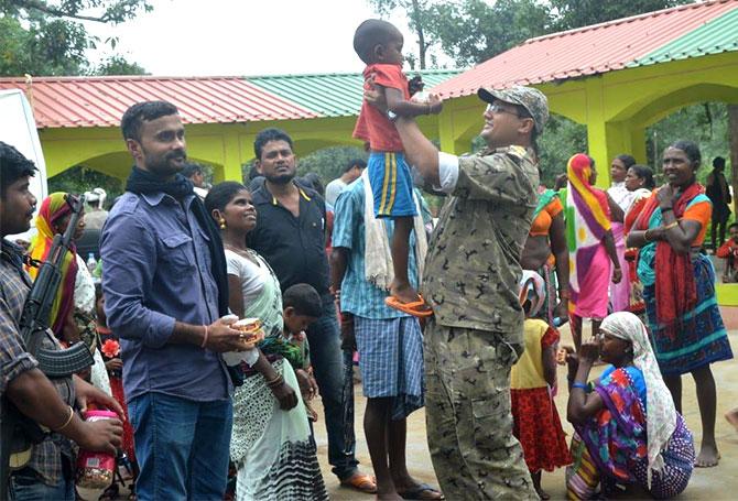 Dr Abhishek Pallava, the SP of Dantewada with villagers in Kudur area of Kondagaon, Chhattisgarh.