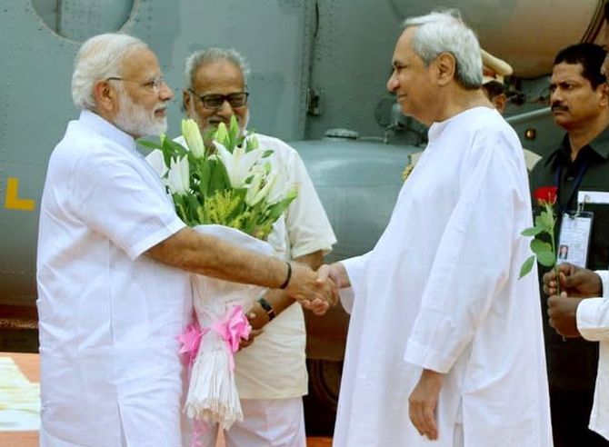 Odisha Chief Minister Naveen Patnaik, right, greets Prime Minister Narendra Damodardas Modi