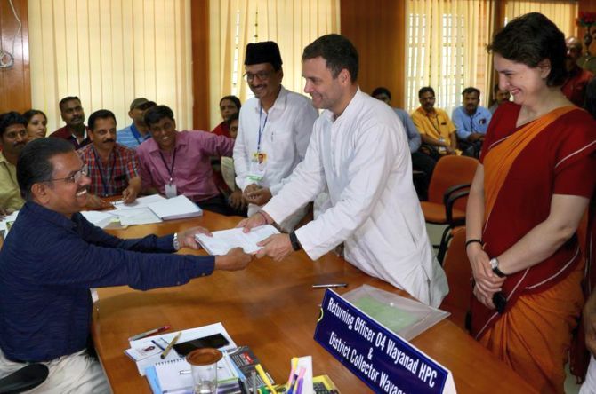 Congress President Rahul Gandhi, accompanied by his sister Priyanka Gandhi Vadra, submits his nomination for the Wayanad Lok Sabha seat to District Collector Ajayakumar A R, the returning officer for the constituency, April 4, 2019. Photograph: Kind courtesy @INCIndia/Twitter