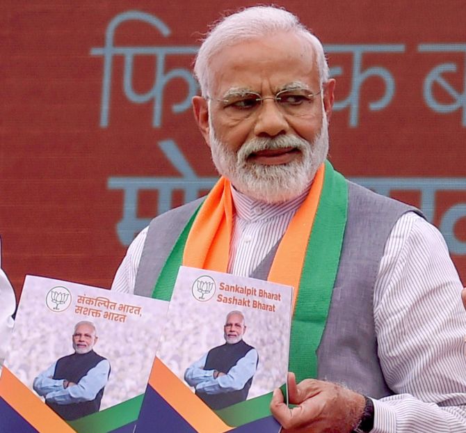 BJP manifesto: Committed to abrogate Articles 370, 35A - Rediff.com ...