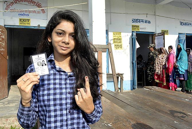 A young woman voter shows her finger marked with indelible ink after casting her vote during the first phase of the general election in Cooch Behar, West Bengal, April 11, 2019. Photograph: PTI Photo