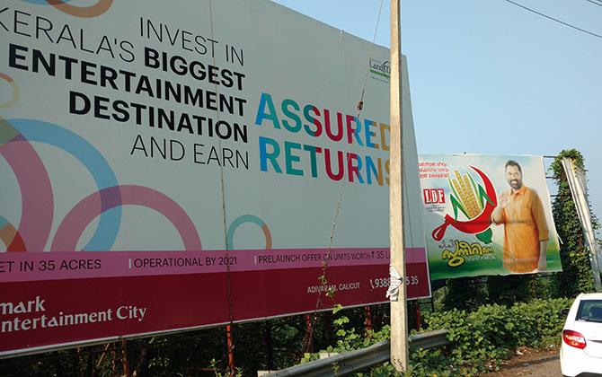 A billboard for P P Suneer on one of the nine hairpin bends on the Wayanad-Kozhikode route. Photograph: Rediff.com