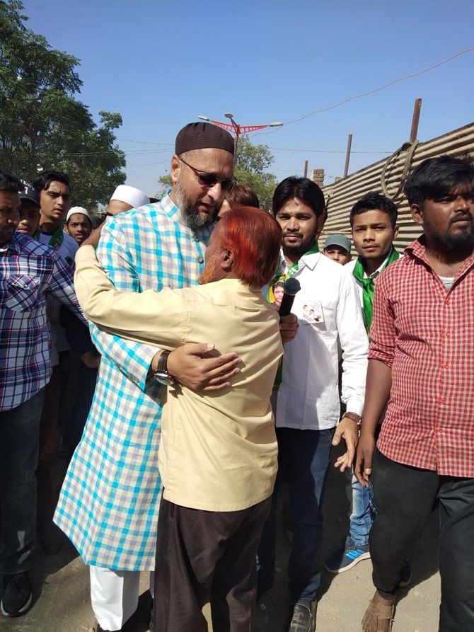 Asaduddin Owaisi embraces a voter during his padyatra in Aurangabad