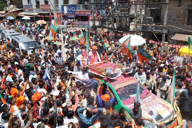 Bharatiya Janata Party national President Amit Anilchandra Shah addresses a road show at Sanand in Ahmedabad, Gujarat. Photograph: ANI Photo