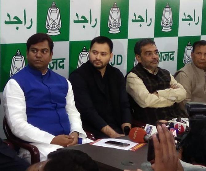 VIP national President Mukesh Saini, left, with Tejashi Yadav and Upendra Kushwaha