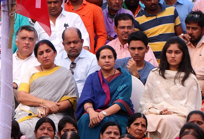 NCP MP Supriya Sule's family at a rally in Baramati, Maharashtra. Husband Sadanand Sule far left, son, Vijay and daughter, Revati, far right. Photograph: Rajesh Karkera/Rediff.com.