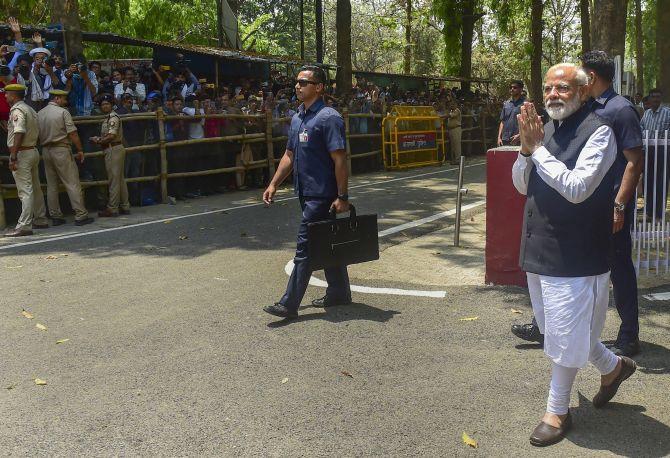 Prime Minister Narendra Damodardas Modi greets crowds after filing his nomination papers in Varanasi, April 26, 2019. Photograph: Mahender Vashisht/PTI Photo