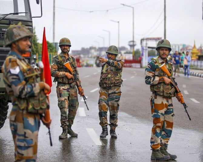 Army personnel stand guard in Jammu on Aug 5, 2019.