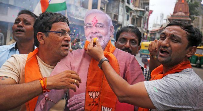 Prime Minister Narendra Modi's supporters celebrate in Ahmedabad, Gujarat, after the government scrapped the special status for Kashmir. Photograph: Amit Dave/Reuters