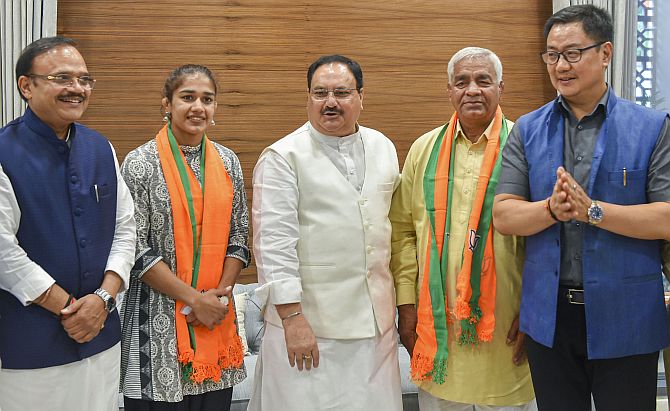 Image result for Wrestler Babita Phogat and her father Mahavir Singh Phogat join BJP