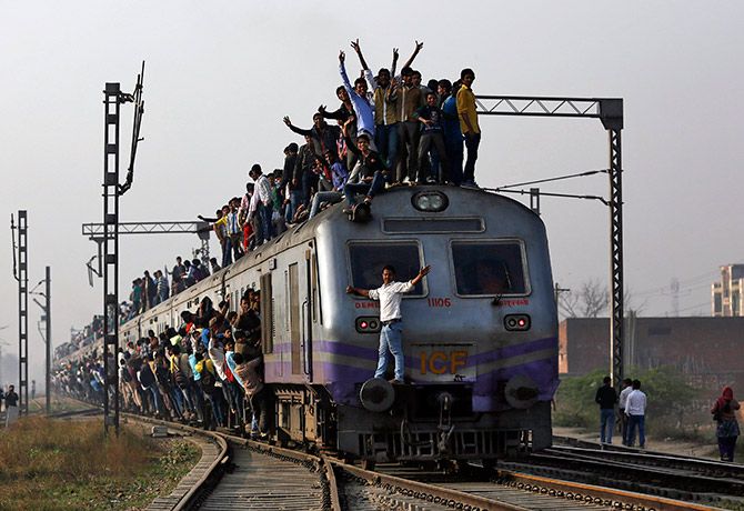 An overcrowded train on the outskirts of New Delhi. Photograph: Ahmad Masood/Reuters.