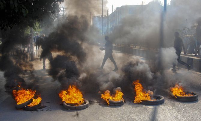 Demonstrators burn tyres during a strike called by the All Assam Students Union and the North East Students Organisation in protest against the Citizenship Amendment Bill in Guwahati on December 10, 2019