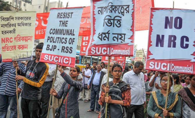 Activists of SUCI (Communist) raise slogans during a protest rally against NRC (National Register of Citizens) and Citizenship (Amendment) Bill, in Kolkata, on Tuesday
