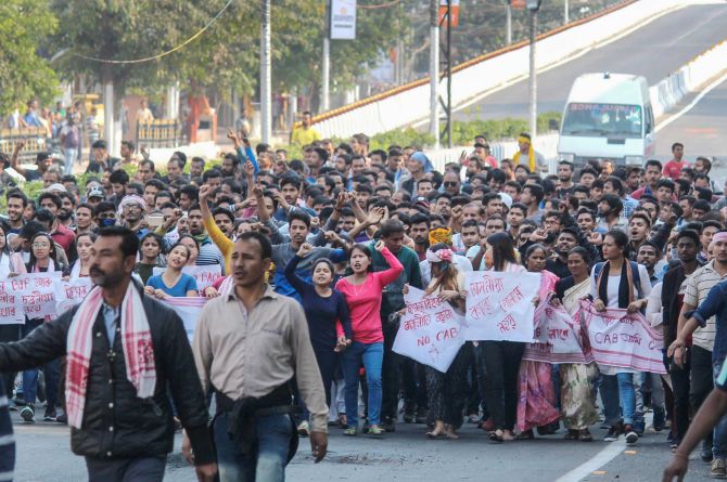 Thousands of people defied curfew in Guwahati and took to the streets, prompting police to open fire, December 12, 2019. Photograph: PTI Photo