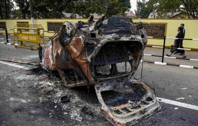 Frenzied mobs blocked roads with burning tyres and menaced commuters by bludgeoning their vehicles with sticks and stones. Photograph: PTI Photo
