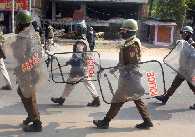 Security personnel patrol a street during curfew at GS Road in Guwahati on Friday