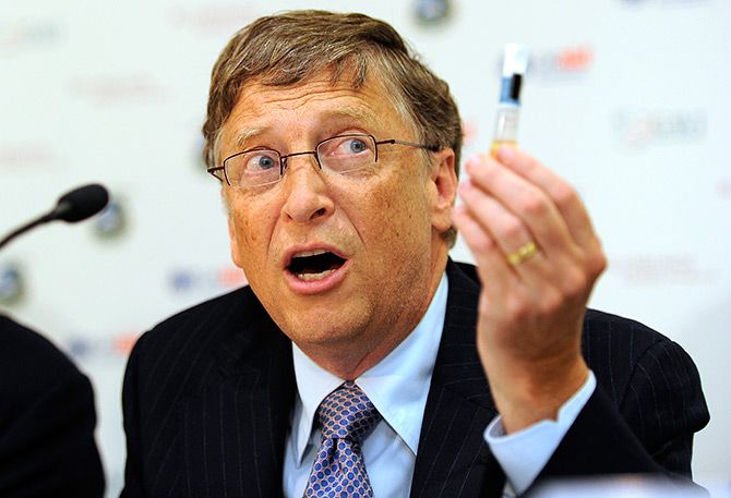 Billionaire philanthropist Bill Gates holda up a Rotavirus vaccine at the Global Alliance for Vaccines and Immunisation conference in London, June 13, 2011. Photograph:  Paul Hackett/Reuters
