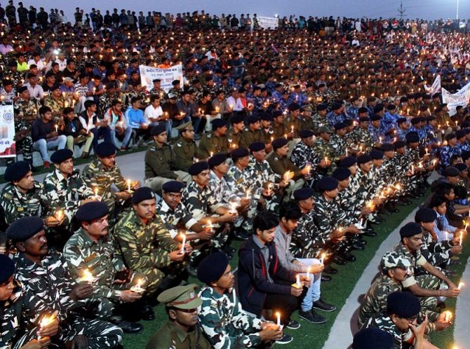 Central Reserve Police Force personnel lit candles to pay tribute to the CRPF jawans murdered in the Pulawama terror attack, at the Shaurya Smarak in Bhopal, February 16, 2019. Photograph: ANI Photo