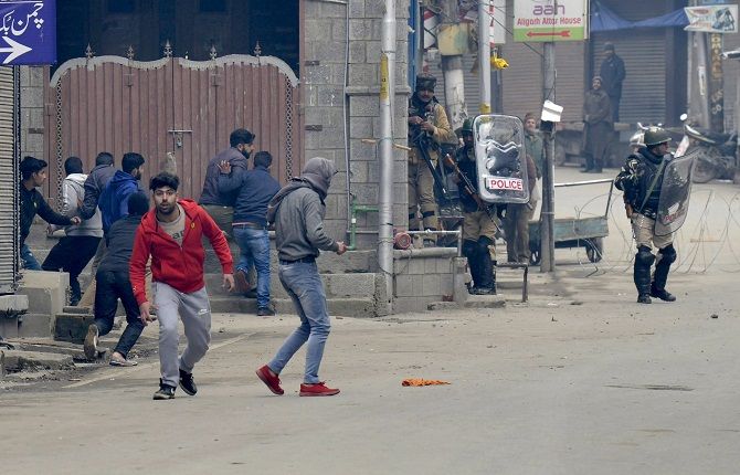 Protestors clash with police after National Investigation Agency officers conducted a raid at separatist leader Yasin Malik's home in Srinagar. Photograph: ANI Photo