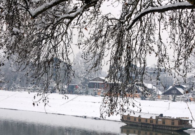 Kashmiris on a snowy day in Srinagar