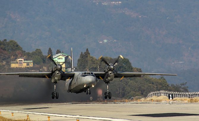 IMAGE: An AN-32 aircraft  lands at Pakyong airfield in Pakyong, on Wednesday. This is the first landing by an AN-32 class of aircraft at the airfield, one of the highest airfields in India. Photograph: PTI Photo