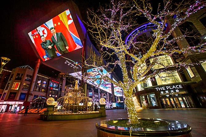 A screen displays a CCTV news report about the meeting between Chinese President Xi Jinping and North Korean leader Kim Jong Un at a shopping mall in Beijing, January 10, 2019. Photograph: Thomas Peter/Reuters