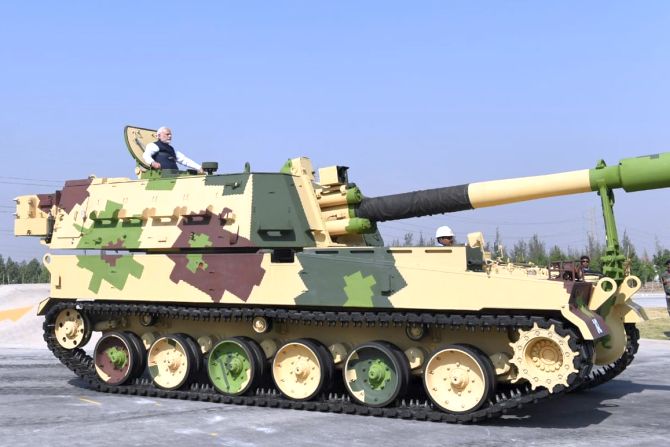 Prime Minister Narendra Damodardas Modi aboard a tank at Larsen and Toubro's armoured systems complex facility at Hazira, Gujarat, January 19, 2019