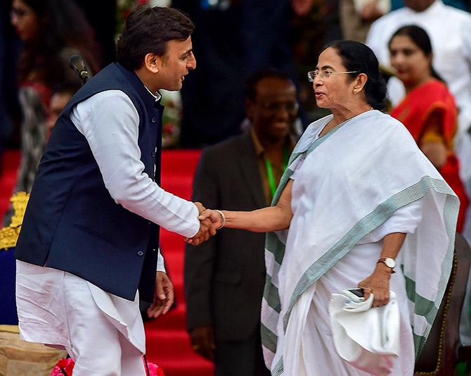 West Bengal Chief Minister Mamta Banerjee greets Samajwadi Party leader Akhilesh Yadav in Bengaluru. Photograph: Shailendra Bhojak/PTI Photos