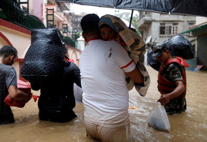 PHOTOS: 67 Die, Flooded Nepal Pleads For Help - Rediff.com India News