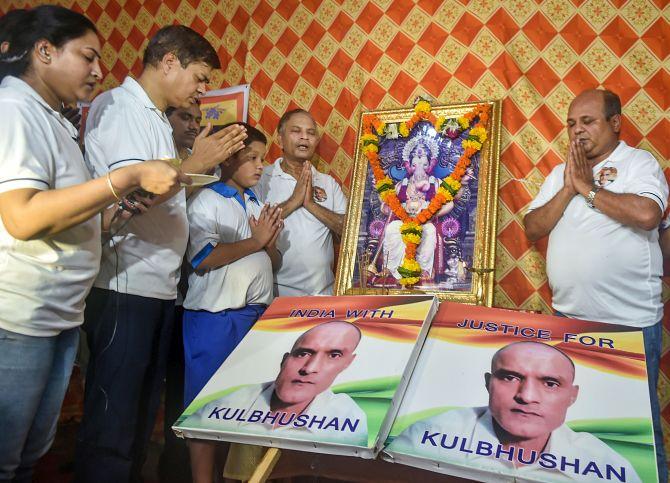 Commander Kulbhushan Jadhav (retd)'s childhood friends and their families in Mumbai celebrate the International Court of Justice's verdict, July 27, 2019. Photograph: Mitesh Bhuvad/PTI Photo