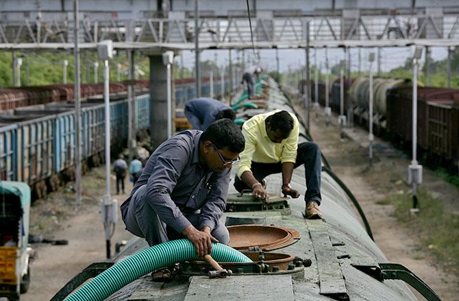A worker fills a tanker train with water, which will be transported and supplied to drought-hit city of Chennai, at Jolarpettai railway station in Tamil Nadu. Photograph: P Ravikumar/Reuters.