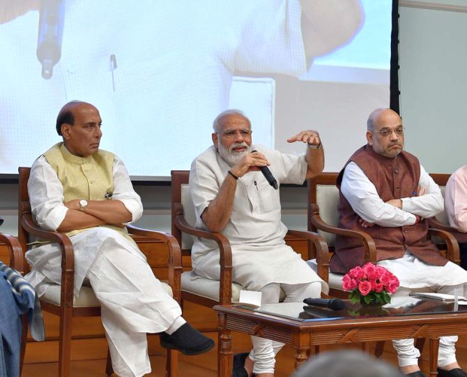 Prime Minister Narendra Damodardas Modi, flanked by Defence Minister Rajnath Singh, left, and Home Minister Amit Anilchandra Shah. Photograph: Press Information Bureau