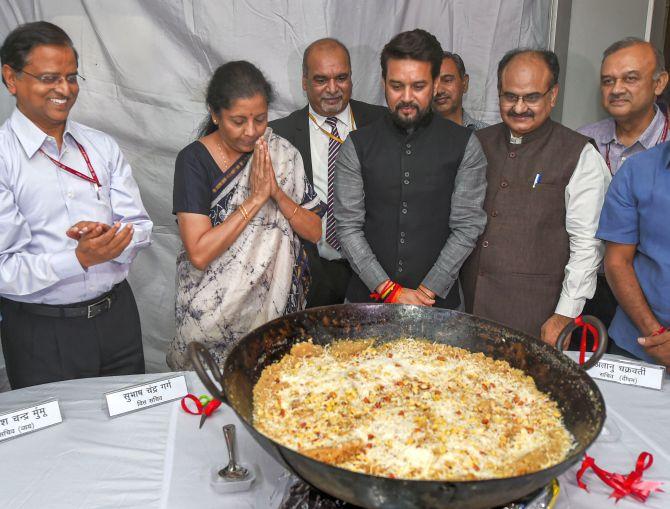 Finance Minister Nirmala Sitharaman and Minister of State for Finance Anurag Thakur at the Halwa ceremony to mark the beginning of printing of budgetary documents in New Delhi, June 22, 2019. Photograph: Shahbaz Khan/PTI Photo