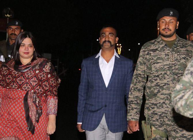 Wing Commander Abhinandan Varthaman, centre, flanked by a Pakistan Ranger named Faisal, to his left,  and Pakistan diplomat Fareeha Bugti, to his right, at the Wagah border, March 1, 2019. Bugti was the first woman from Balochistan to join the Foreign Service of Pakistan in 2005. Photograph: PTI Photo