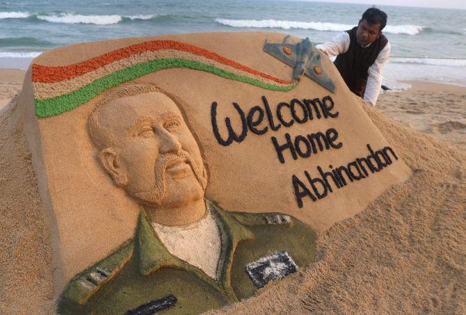 Sand artist Sudarsan Pattnaik with a sand sculpture of Wing Commander Abhinandan Varthaman at the beach in Puri, March 1, 2019. Photograph: PTI Photo