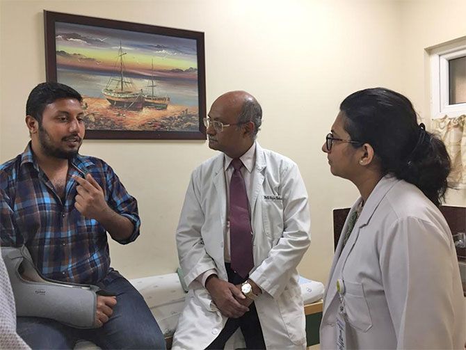Dr Raja Sabapathy with a patient