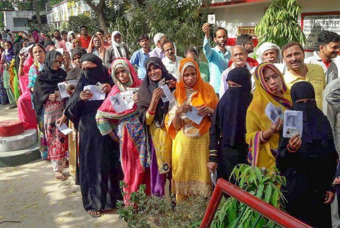 Voters wait to cast their ballot in the sixth phase of polling, May 12, 2019.