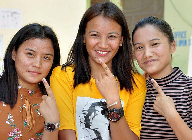 First-time voters show their inked fingers after casting their votes in Manali on Sunday, May 19, 2019. Photograph: PTI Photo