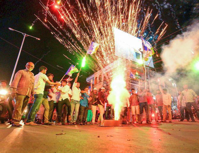 YSR Congress activists in Vijayawada celebrate the party's victory in the assembly and Lok Sabha elections. Photograph: PTI Photo