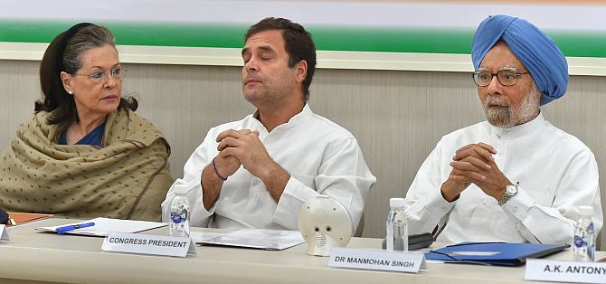 Congress national President Rahul Gandhi, centre, flanked by Sonia Gandhi, the Congress MP from Rae Bareli, left, and former prime minister Dr Manmohan Singh at the Congress Working Committee meeting, May 25, 2019