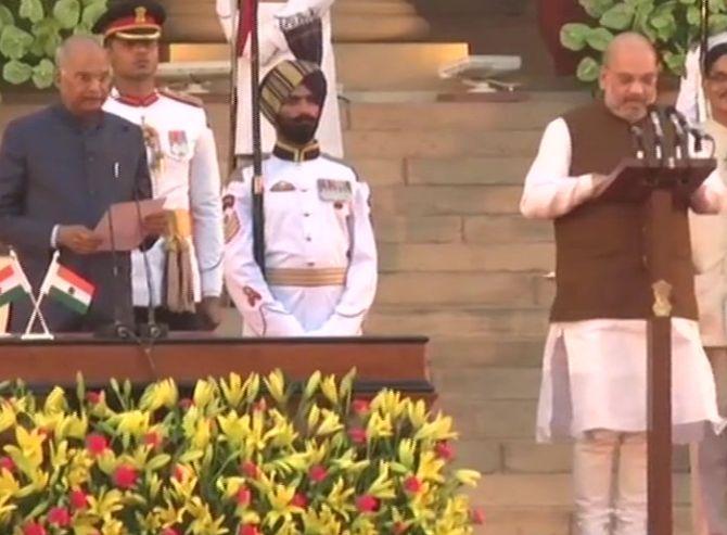 Amit Anilchandra Shah takes the oath of office as a Caibinet minister and swears to defend the Constitution of India. Photograph: Vijay Verma/PTI