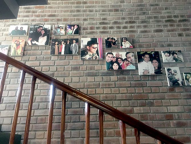 The staircase is lined with happy pictures of the young Major Akshay Girish. 'He was a remarkable boy,' says Mrs Girish.