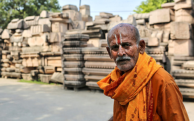 A man walks past the pillars that the Vishwa Hindu Parishad says will be used to build a Ram temple in this photograph taken on October 22, 2019. Photograph: Danish Siddiqui/Reuters