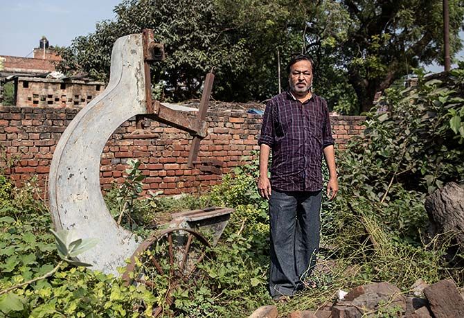 Mohammed Shahid, grandson of Haji Abdul Gaffar, the last imam of the Babri mosque, in front of a sawmill which was burnt down by mobs after the Babri Masjid demolition, in Ayodhya, in this photograph taken on October 22, 2019. Photograph: Danish Siddiqui/Reuters