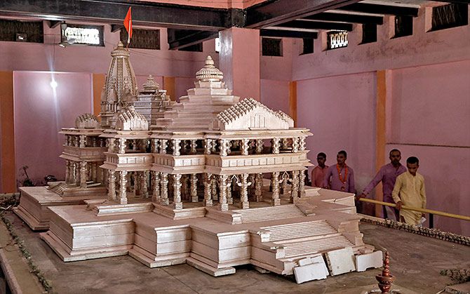 Devotees look at a model of the proposed Ram temple that Hindu groups want to build at the disputed Ram Janambhoomi/Babri Masjid site in Ayodhya, in this photograph taken October 22, 2019. Photograph: Danish Siddiqui/Reuters