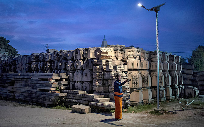 A devotee takes a selfie with the pillars that the VHP says will be used to build a Ram temple in this picture taken on October 21, 2019. Photograph: Danish Siddiqui/Reuters