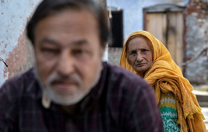 Zaibunissa, whose husband was killed in the riots following the Babri Masjid demolition on December 6, 1992, with her son Mohammed Shahid in Ayodhya, in this picture taken on October 22, 2019. Photograph: Danish Siddiqui/Reuters